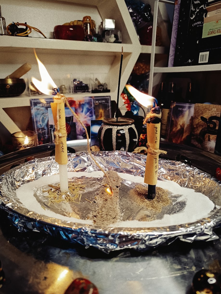 Inscribed candles joined by cord for the Rite of Unbinding