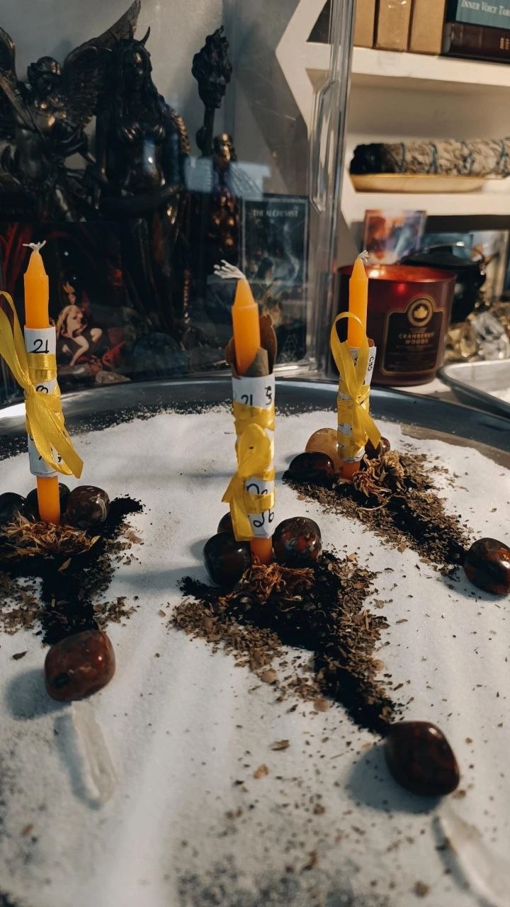 Cord-cutting candles burning during a Rite of Becoming