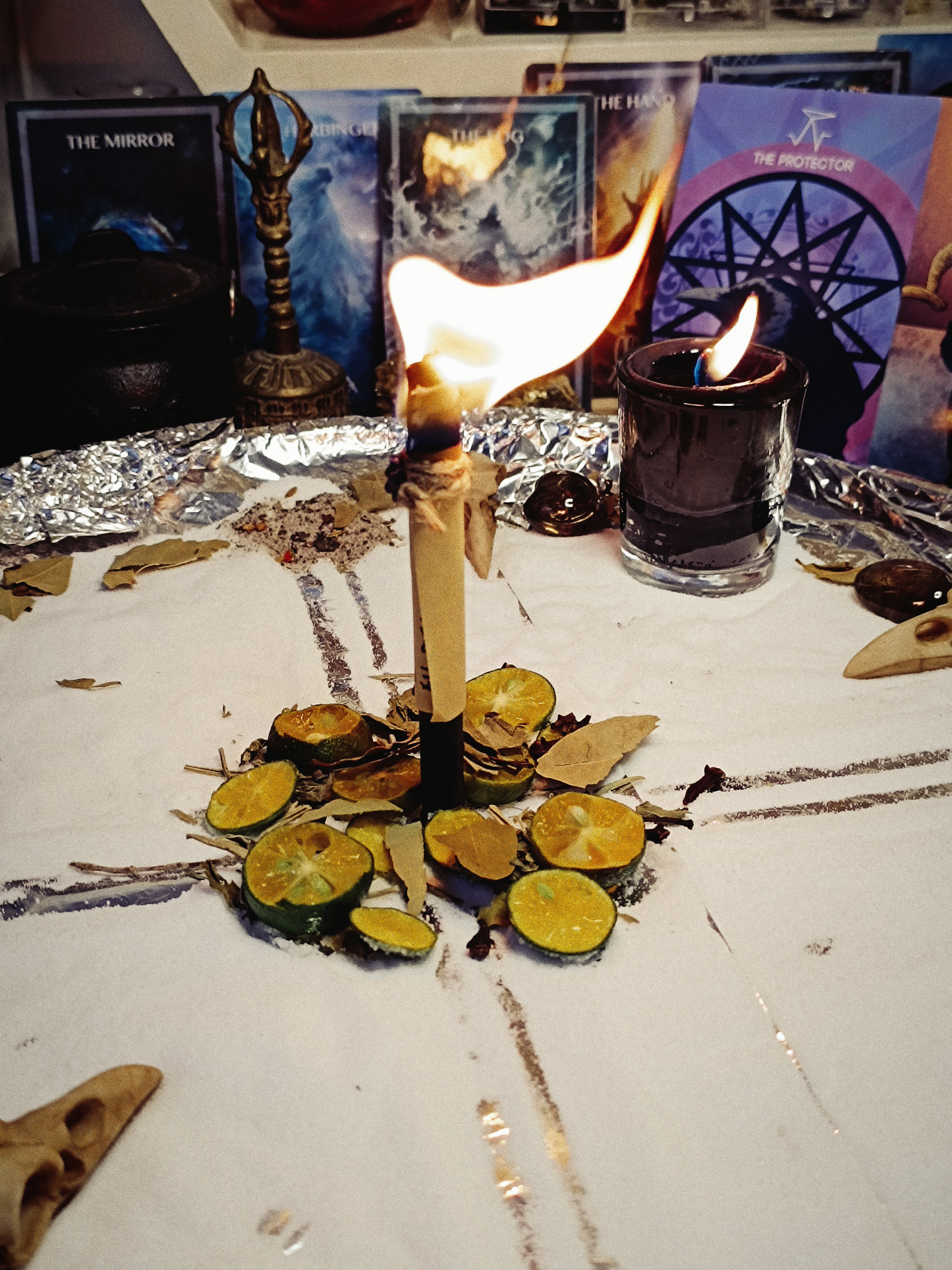 The Uncrossing candle burning during the cleansing and separation working